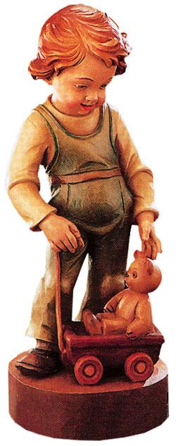 Pastorcito con carrito de madera y osito de peluche