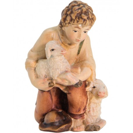 Pastorello in ginocchio con pecore e agnello in braccio - colorato a olio