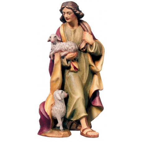 Shepherd with sheep on his feet and lamb in his arms