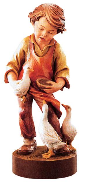 Enfant Jésus en bois sculpté avec des oies