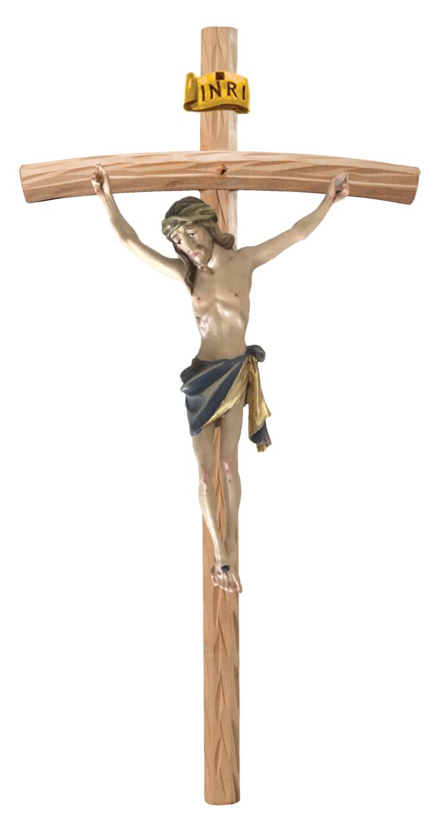 Christuskörper aus Holz auf gebogenen hellen Balken - Blaues Tuch