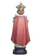 Enfant Jésus de Prague sculpté en bois avec monde