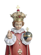 Enfant Jésus de Prague sculpté en bois avec monde