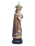 Enfant Jésus de Prague sculpté en bois avec monde