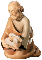 Figurine en bois de berger agenouillé