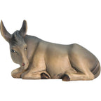 Lying donkey for artisanal wooden nativity scene sculpted in Val Gardena