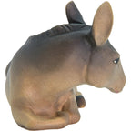 Lying donkey for artisanal wooden nativity scene sculpted in Val Gardena